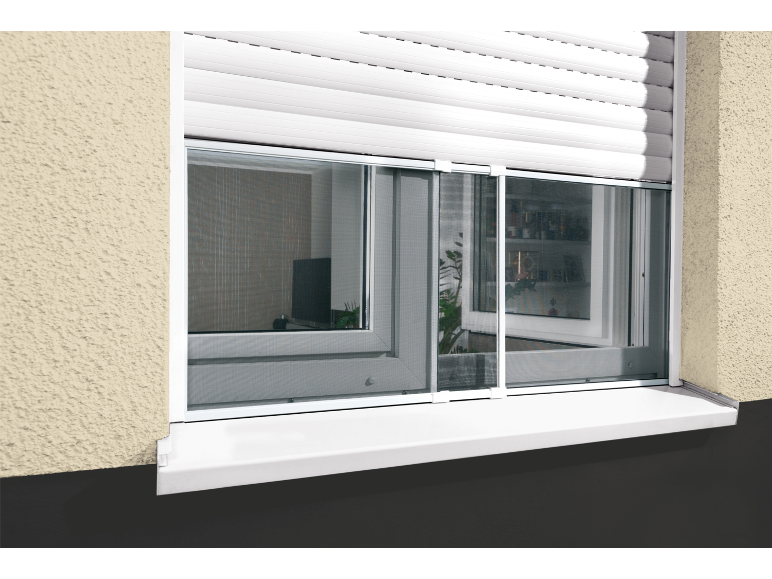 White window with roller shutters and insect screen on a beige facade.
