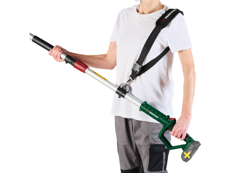 Man holding a telescopic pole pruner with a shoulder strap.