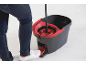 Person using a mop bucket with a pedal wringer to clean the floor.