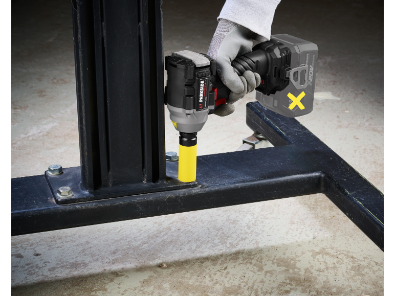 Gloved hand using a cordless impact wrench to tighten a bolt.