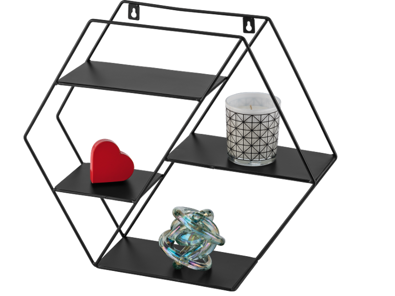 Black hexagonal wall shelf with a red heart, candle, and glass ornament.