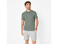 Man in a grey polo shirt and light grey shorts.