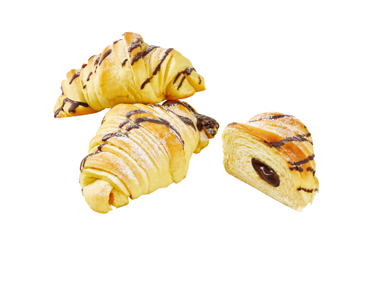 Chocolate croissants with powdered sugar, one cut in half.