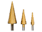 Set of three golden step drills with marked sizes from 4 to 32 mm.