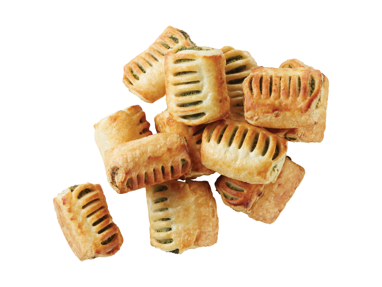 A pile of mini puff pastry rolls with green filling.