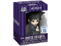 Wednesday action figure with umbrella in striped purple packaging.