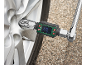 Digital torque wrench adapter on a car wheel.