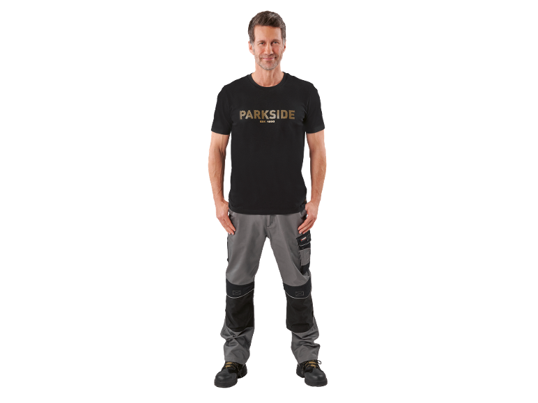 Man in black t-shirt with «PARKSIDE EST. 1996» inscription and grey work trousers.
