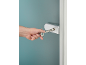 Hand using a service square key to open a door lock.