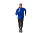 Man running in blue jacket and black pants.