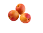 Three ripe apricots with red and orange hues on a black background