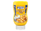 Bottle of cheese style sauce with french fries and a bowl of sauce.