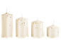 Four white candles of varying sizes with gold star-shaped glitter.