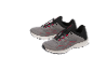A pair of grey sports shoes with red details and elastic laces.