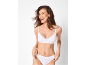Laughing woman in white cotton bra and briefs with lace details.
