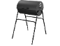 Black barrel charcoal grill on a stand with a handle and a ventilation opening.