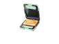 Green sandwich toaster with a piece of toast inside