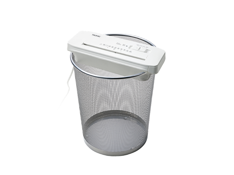 White paper shredder on a metal waste bin.