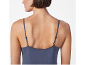 Woman in blue spaghetti strap top, back view