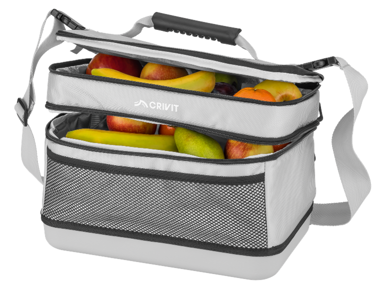 Two-tier cooler bag filled with fresh fruit, including apples, bananas, and oranges.
