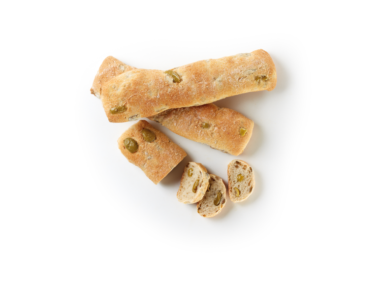 Olive breads, some sliced, on a white background.