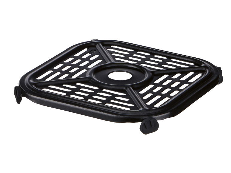 Black air fryer rack with a perforated surface and rubber feet.