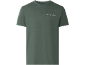 Green short-sleeved t-shirt with the text 'Thrive in the unknown'.