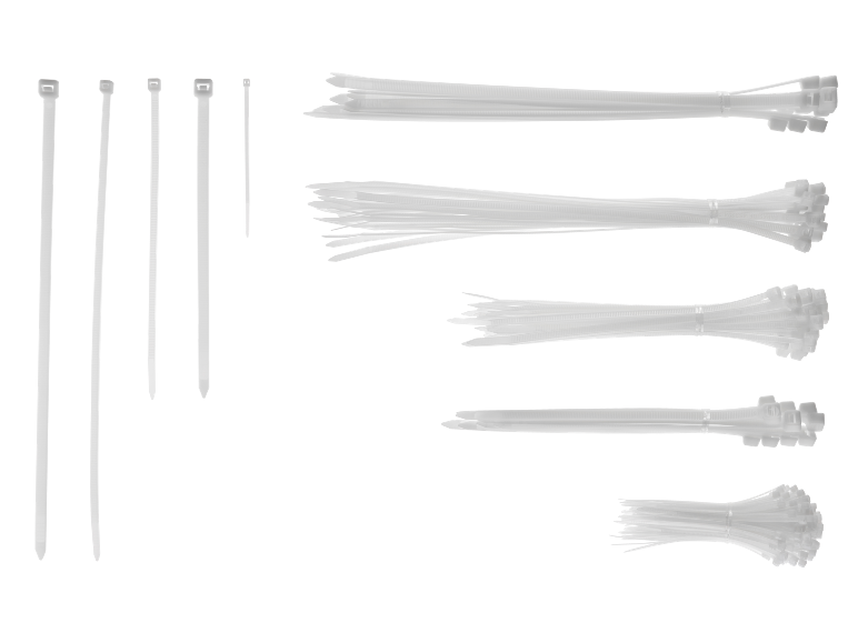 Various sizes and bundles of white cable ties on a black background.