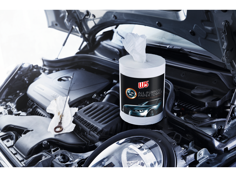All-purpose paper towels roll in a car engine bay, with an oil dipstick and rag.