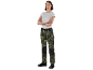 Woman in camouflage work trousers and white t-shirt with crossed arms.