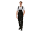 Man in black denim overalls, white t-shirt, and work boots.