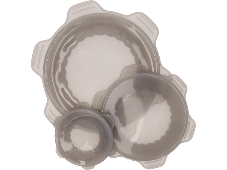 Set of three round, transparent food storage containers with wavy edges.