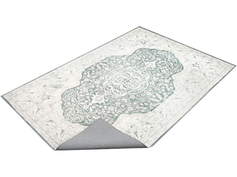 Rug with classic medallion design in cream and mint green tones, with visible anti-slip backing.
