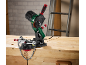 Electric chain sharpener on a wooden workbench.