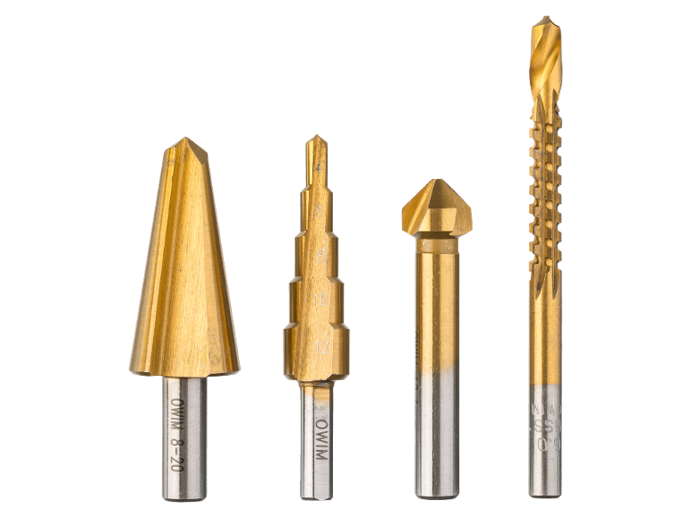 Four gold-colored step drills and countersink bits of various sizes on a black background.