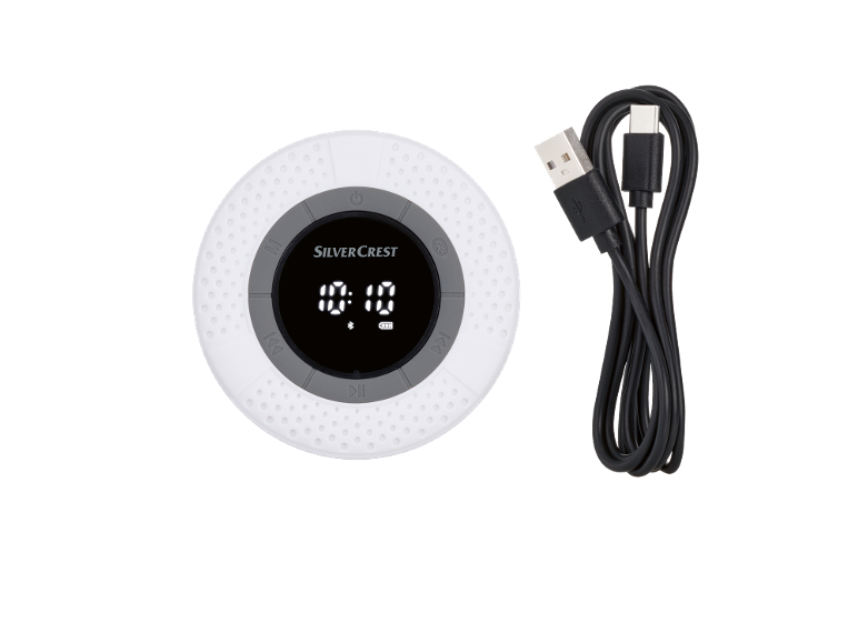 White waterproof Bluetooth speaker with a digital display and a black USB charging cable.