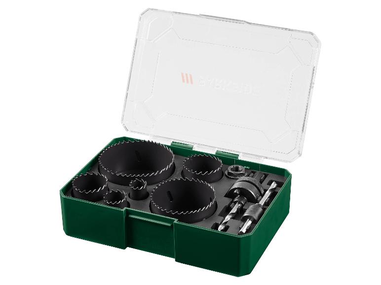 Hole saw set in a green case with a clear lid, including various saw sizes and drill bits.