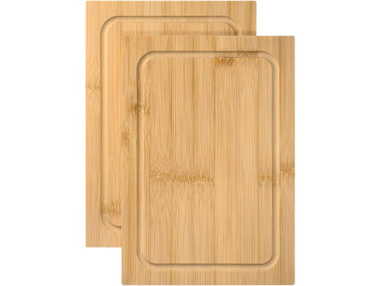 Two bamboo cutting boards with juice grooves
