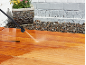 Cleaning wooden decking with a pressure washer