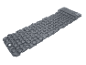 Grey inflatable sleeping pad with a pillow, featuring a textured surface.