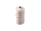 Spool of white cotton string on a black background.
