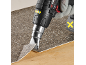 Cordless heat gun with nozzle, used for lifting floor tiles.
