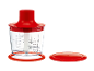 Red and clear food chopper with measuring marks up to 500 ml, with a separate red lid.
