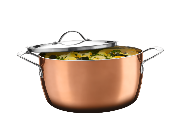 Copper pot with a metal lid, filled with diced vegetables