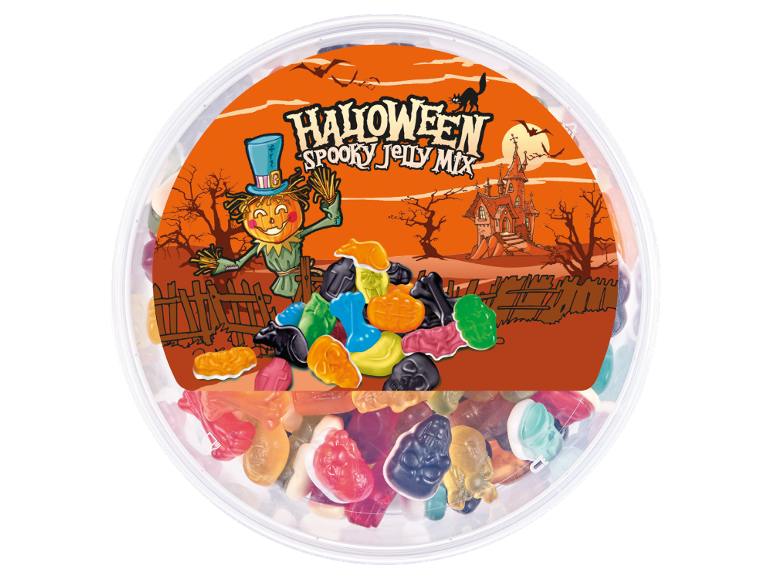 Halloween jelly candies in spooky shapes in a tub, with a scarecrow and haunted house.