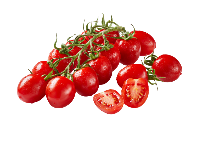 Fresh cherry tomatoes on the vine, some halved, on a black background.