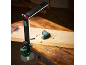 LED battery work light and electric drill on a wooden table.