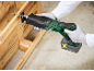 Cordless reciprocating saw cutting a wooden pallet.