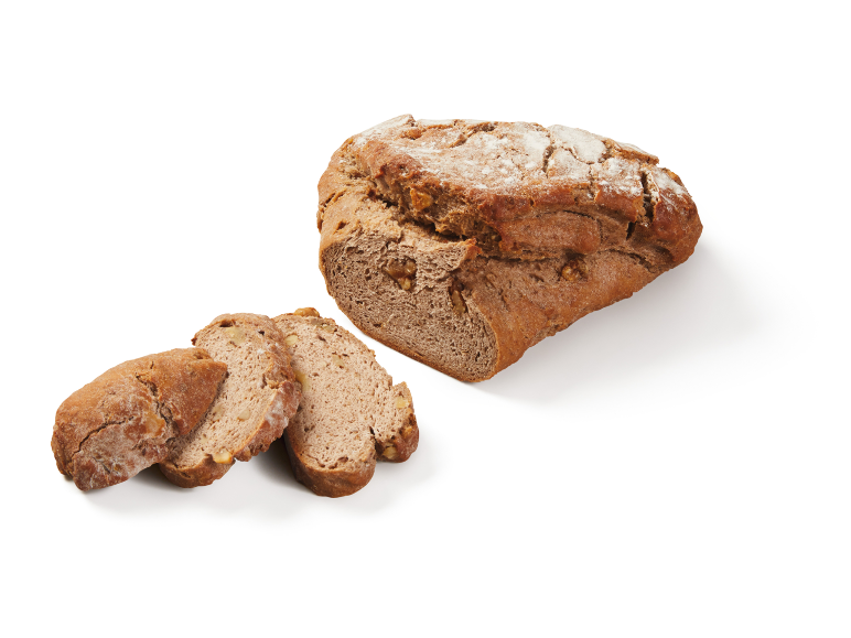 Walnut bread with one whole loaf and two sliced pieces on a white background.