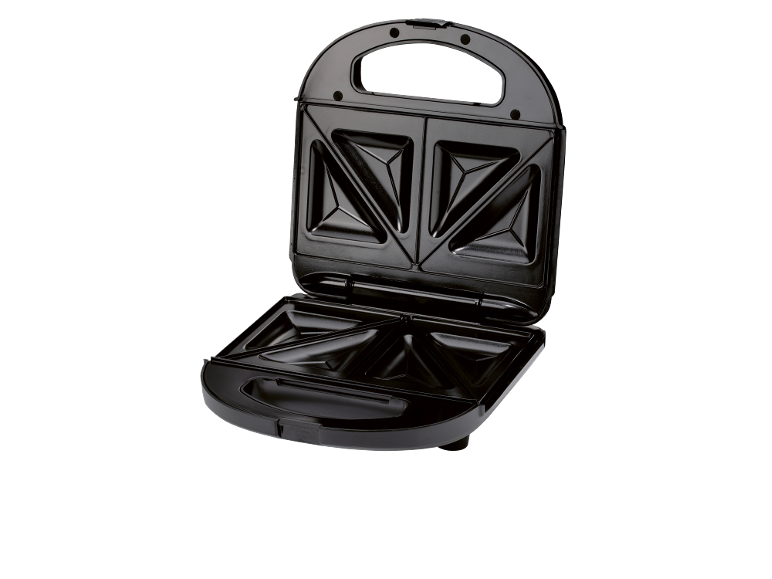 Open black sandwich maker with triangular plates on a black background.